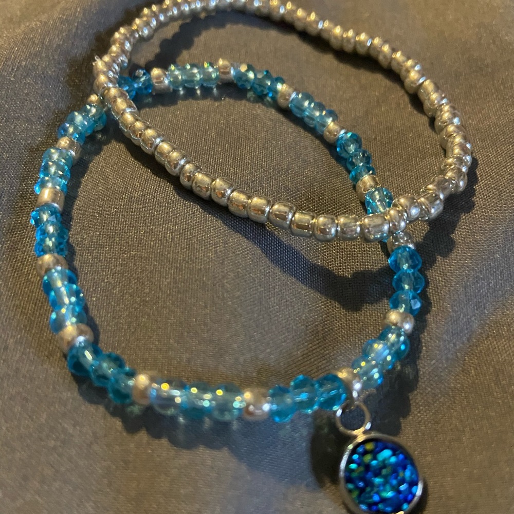 Teal and silver stretch bracelet with teal charm